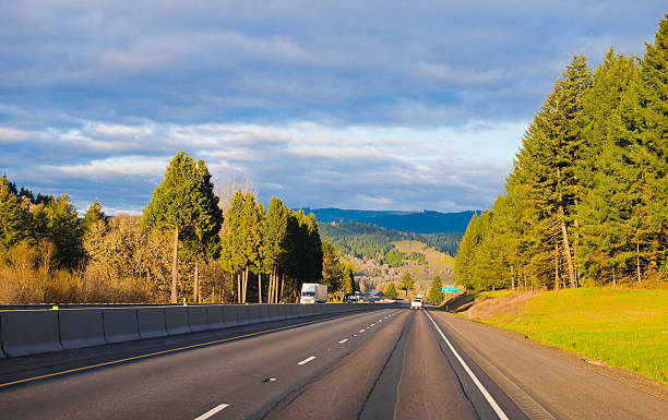 istock Amazing wide interstate highway sunshine toll trees green 473506276