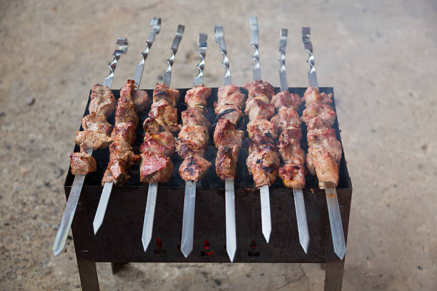 Appetizing shish kebab of lamb on the grill stock photo