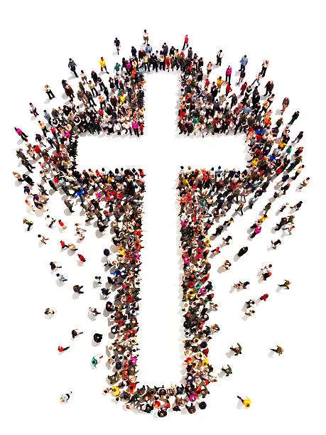  Large crowd of people walking to and forming the shape of a cross on a white background with room for text or copy space in the cross.