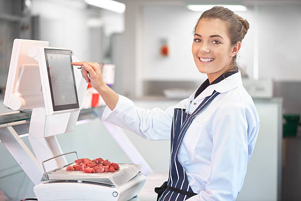 istock young female butcher portrait 473521998