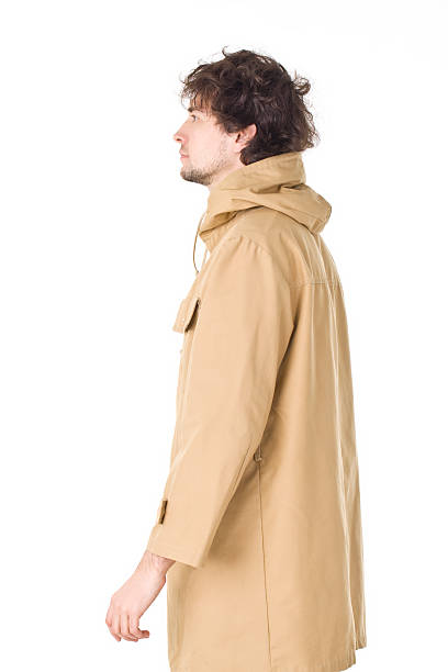 istock Handsome man in brown vintage raincoat. 473522212