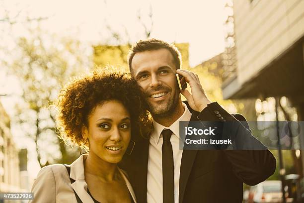 Outdoor Portrait Of Elegant Couple Man Talking On Phone Stock Photo - Download Image Now