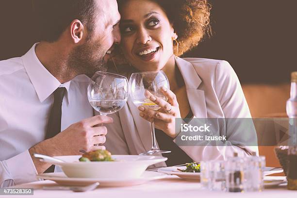 Happy Couple Flirting At Dinner In The Restaurant Stock Photo - Download Image Now - 2015, Adult, Adults Only