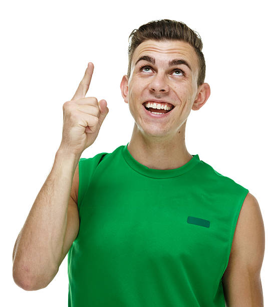 istock Cheerful male athlete pointing up 473529442