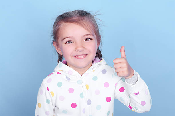 istock Girl showing thumb up 473532622
