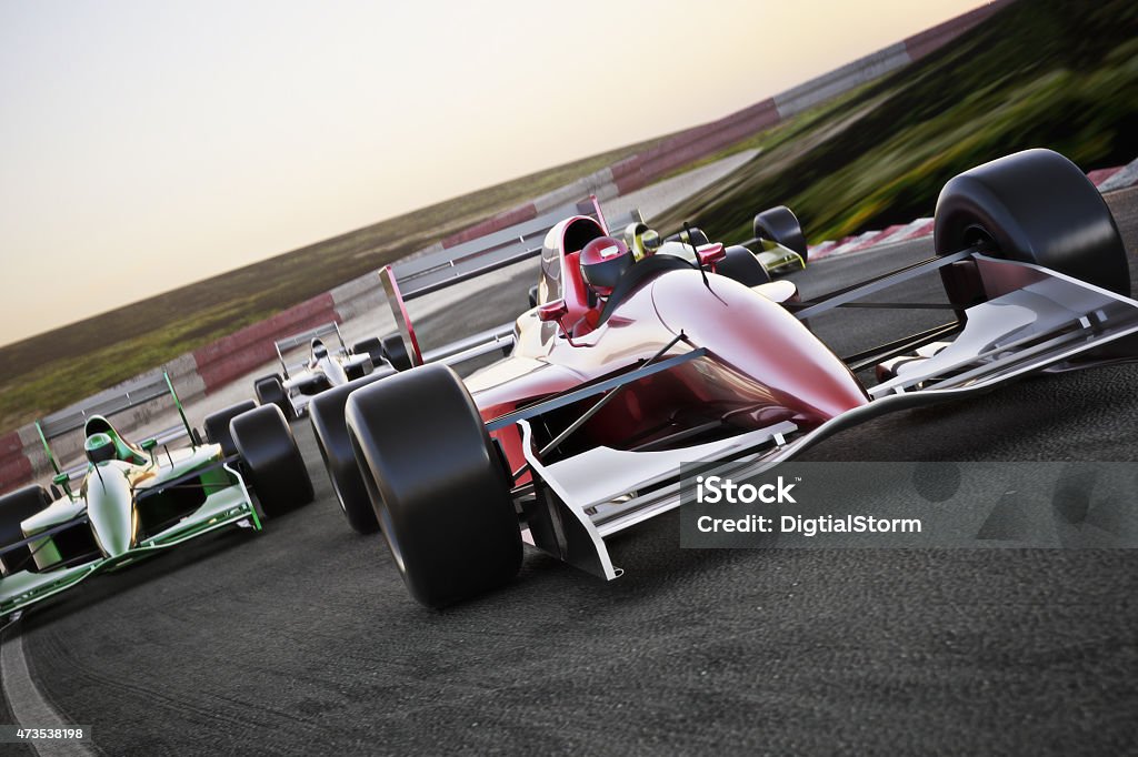 Red race car on a track leading the pack Red race car close up front view on a track leading the pack with motion Blur. Room for text or copy space Racecar Stock Photo