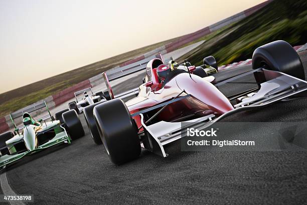Red Race Car On A Track Leading The Pack Stock Photo - Download Image Now - Racecar, Sports Track, Track - Imprint