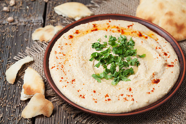 istock Fresh traditional hummus Hebrew lunch with chickpea beans, paprika and 473539094