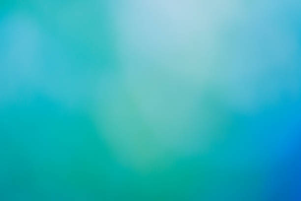 Abstract nature background. Soft and beautiful gradient and bokeh blur in pastel green and blue. Perfect nature background for your spring or summer project. High resolution color photograph with horizontal composition and plenty of room for your copy.