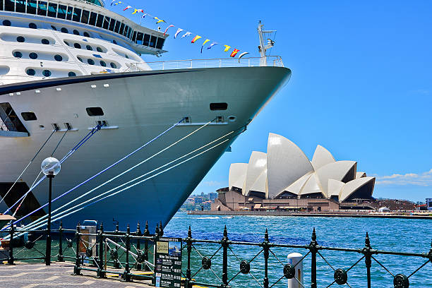 Sydney, Australia - January 25, 2015: View of cruise ship and Sydney skyline in a sunny day on January 25, 2015 in Sydney, Australia.