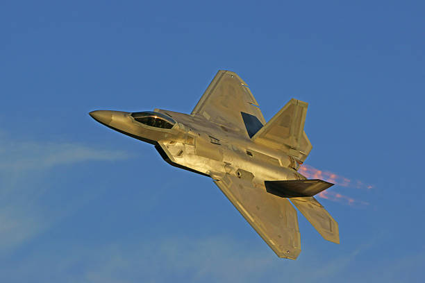 Chino,California,USA- May 1, 2015. F-22 Raptor, modern stealth jet fighter, flying at 2015 Planes of Fame Air Show in Chino, California. The 2015 Planes of Fame Air Show features 3 days of vintage aircraft and modern aircraft performing flying and many static aircraft displays for the general public to view.