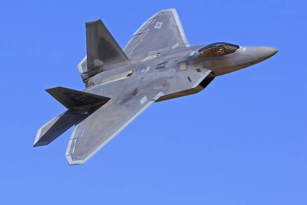 Chino,California,USA- May 1, 2015. F-22 Raptor, modern stealth jet fighter, flying at 2015 Planes of Fame Air Show in Chino, California. The 2015 Planes of Fame Air Show features 3 days of vintage aircraft and modern aircraft performing flying and many static aircraft displays for the general public to view.