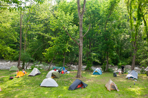 Damascus, Virginia, USA - May 18, 2012: Appalachian Trail thru-hikers camp beside a river during the annual Trail Days festival in Damascus, Virginia. The 2,200-mile Appalachian Trail passes through the town of Damascus.