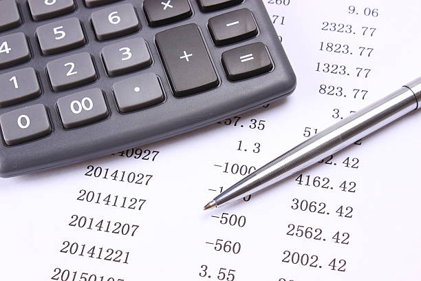 istock Statement of account with pen and calculator 473546640