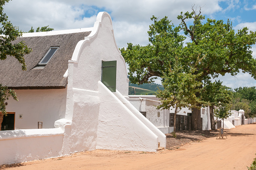 Stellenbosch, South Africa - December 21, 2014: Historic building on the Babylonstoren farm near Paarl. It is a Cape Dutch farm with vineyards, orchards and vegetable gardens
