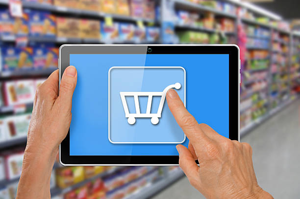 istock Online Supermarket Shopping Tablet with Hands 473549208