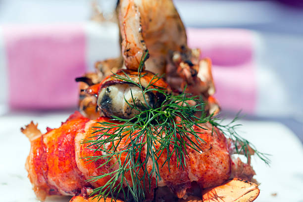 istock Char-Grilled Lobster Tails and Gulf Tiger Prawns 473552262