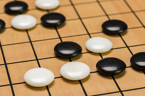 istock closeup view of stones on a Go board 473552884