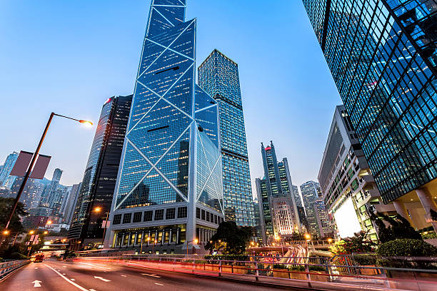 istock traffic light trails and office buildings in modern city 473555350