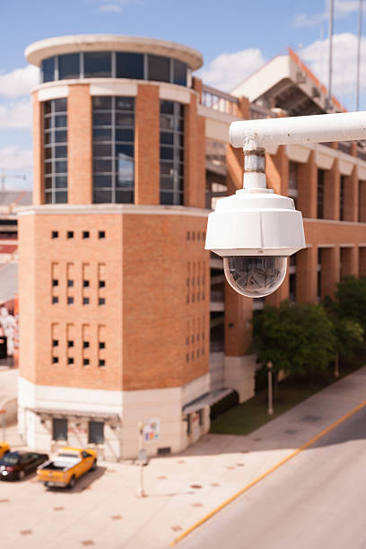 istock Video Security CCTV Camera Housing Mounted High on College Campus 473555362