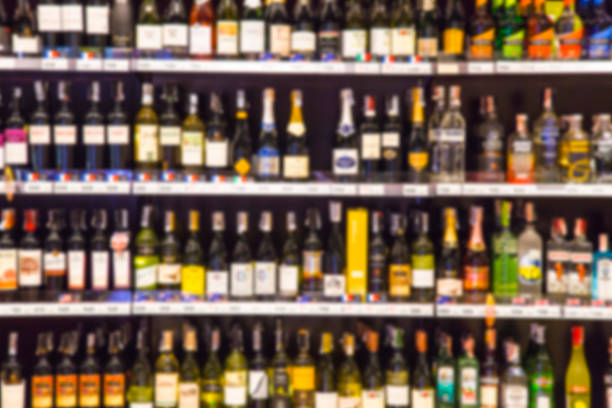 istock Wine Liquor bottle on shelf, Blurred Bar Restaurant background 473555930