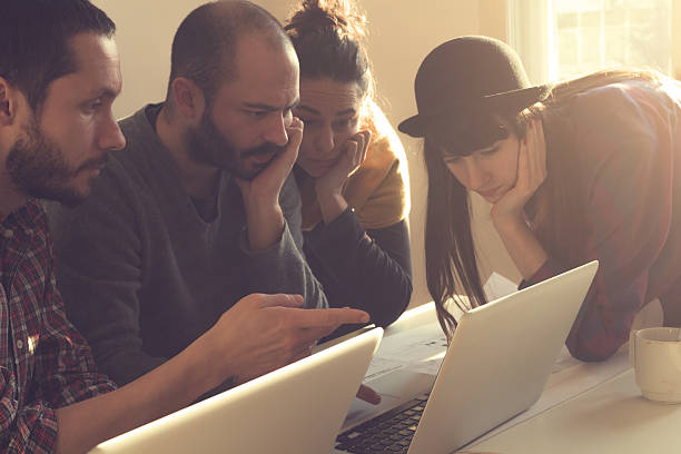 istock Young group of people/architects discussing business plans 473556054