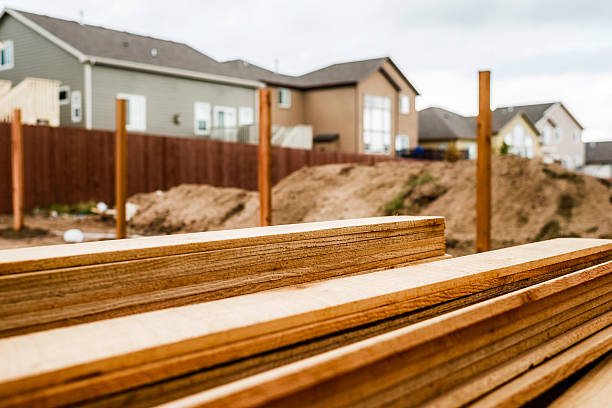 istock New fence construction. Fence posts in background, timber in foreground. 473557970