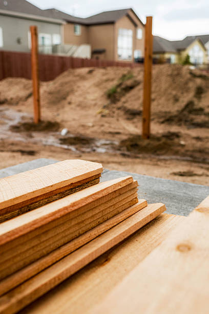 istock New fence construction. Fence posts in background, timber in foreground. 473557978