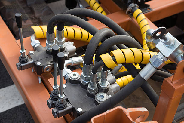 Hydraulic tubes, fittings and levers on control panel Hydraulic tubes, fittings and levers on control panel of lifting mechanism Auxiliary Power Systems for Rolling Stock stock pictures, royalty-free photos & images