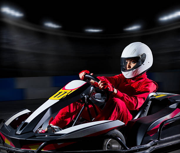 istock Girl karting racer at stadium 473564488