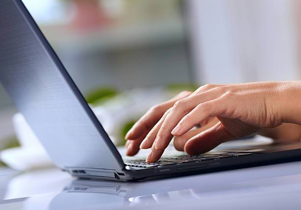istock Woman hands typing on laptop 473564612