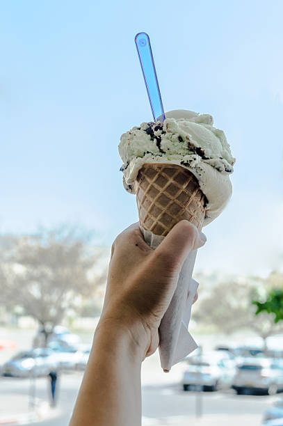 istock ice cream in the hand 473565094