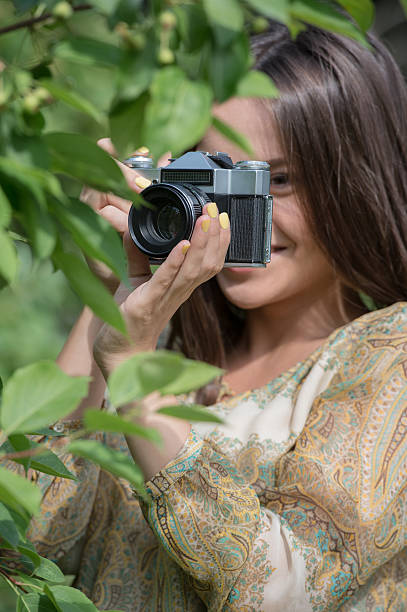 istock Girl vintage retro camera 473566216