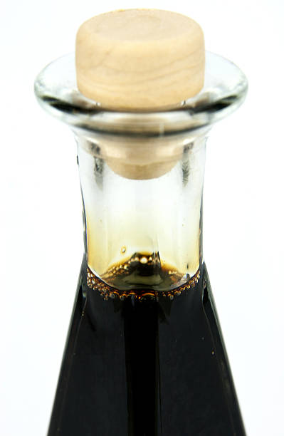 istock Traditional italian balsamic vinegar isolated on white background 473566596