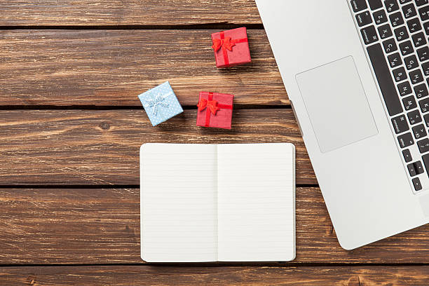 istock Note with gifts and laptop 473569522