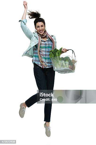 Female Holding Vegetable Basket And Jumping Stock Photo - Download Image Now - One Woman Only, Supermarket, Women
