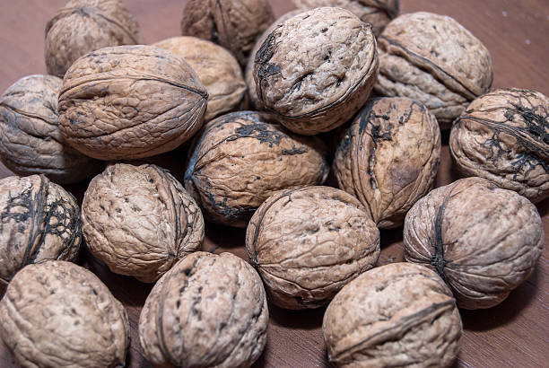 istock Pile of walnut for background 473573424