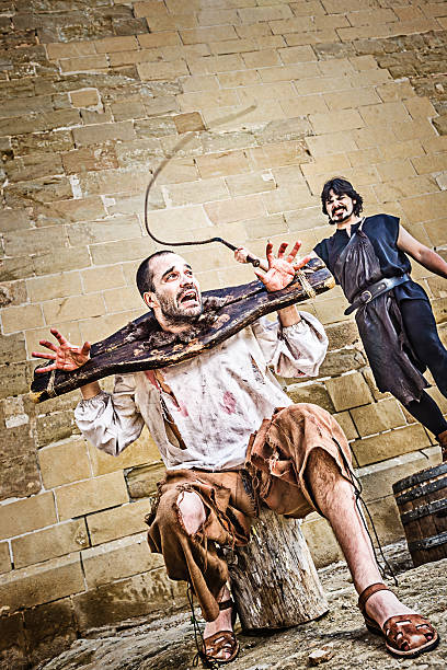 Medieval whipping torture Medieval public whipping torture. whip tortured punishment cruel stock pictures, royalty-free photos & images