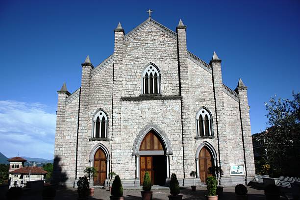 istock Church Stresa Parish Carciano Dwelling under blue sky 473576950
