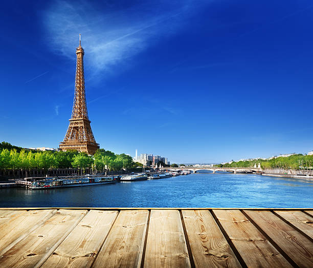 istock background with wooden deck table and Eiffel tower in Paris 473578426