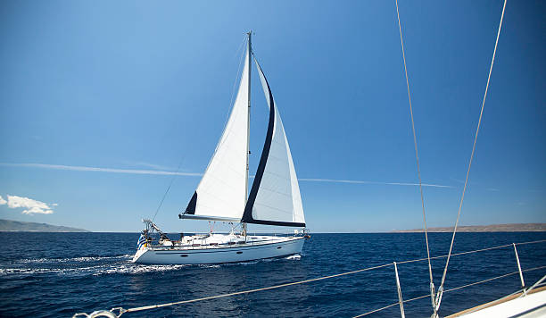 istock Ship yachts with white sails in the open Sea. 473578672