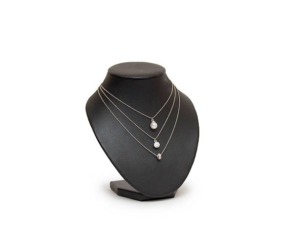 istock Diamond necklace on black mannequin isolated on white background 473578874