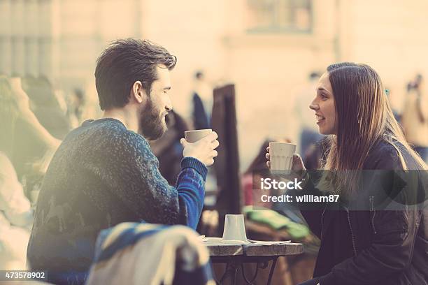 Hipster Couple Drinking Coffee In Stockholm Old Town Stock Photo - Download Image Now