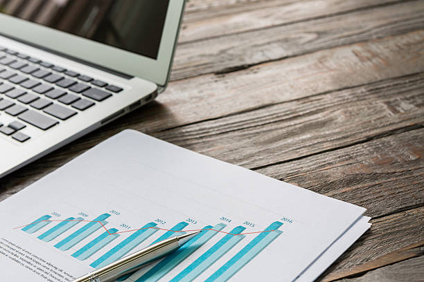 istock Financial charts on the table with laptop 473579292