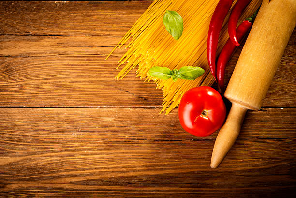 ingredients for spaghetti on a wooden table stock photo