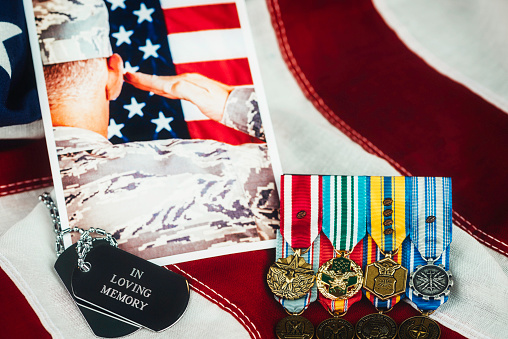 US Memorial Day. Veterans Day. Military Memorial with soldier. Medals, dog tags, photo, US flag