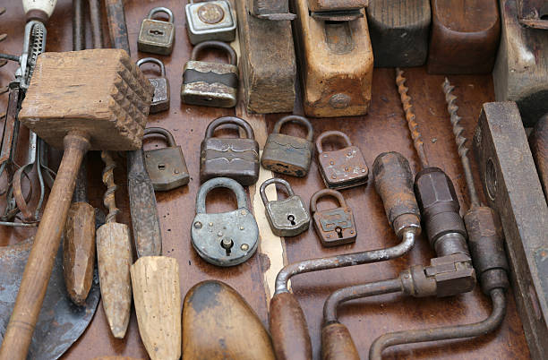 hand drill old rusty padlocks and planers in the workshop of flea market