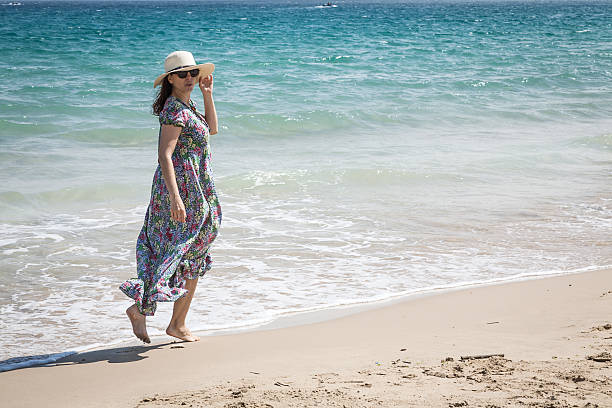 istock Attractive woman on seashore 473593188