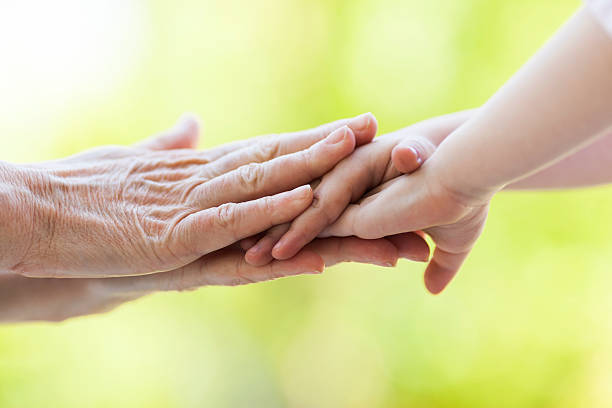 istock Child and Parent Hands 473594000