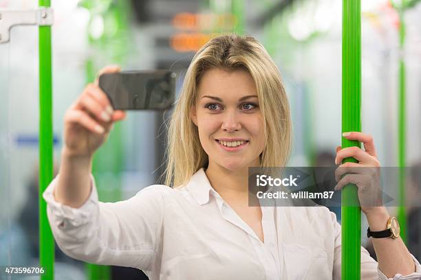 Young Woman Taking A Selfie In London Tube Train Stock Photo - Download Image Now - 2015, Adult, Beautiful People